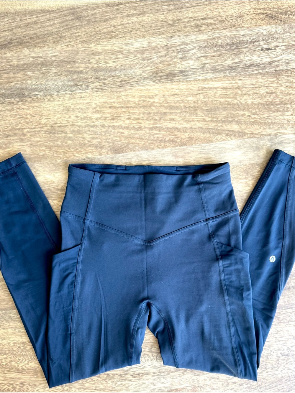 Lululemon performance leggings in a dark navy blue with Side Pockets